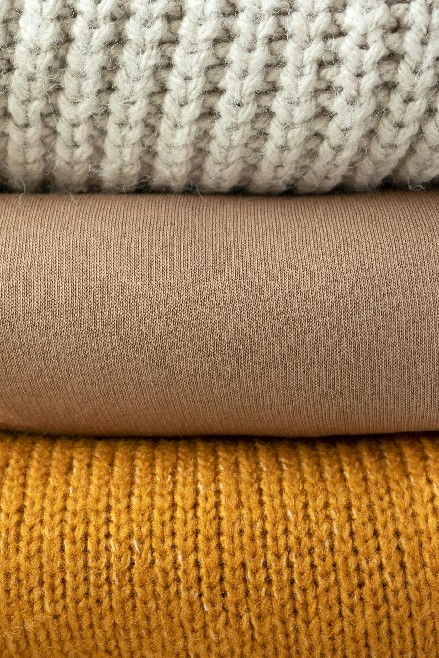 Close-up of a cream and grey merino knit